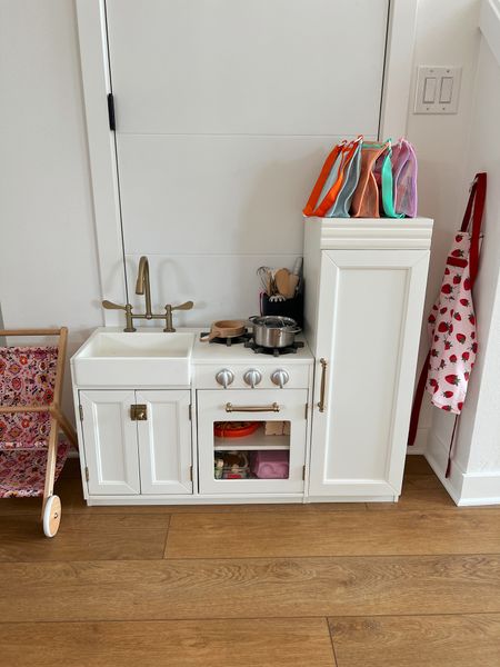 Toddler play kitchen from pottery barn we love it so much! Swapped the handles to our own to match the kitchen lol. Colorful mesh bags are the best for storing small toys! Okay food plastic & felt. Pots & pans 

#LTKhome #LTKkids #LTKunder100