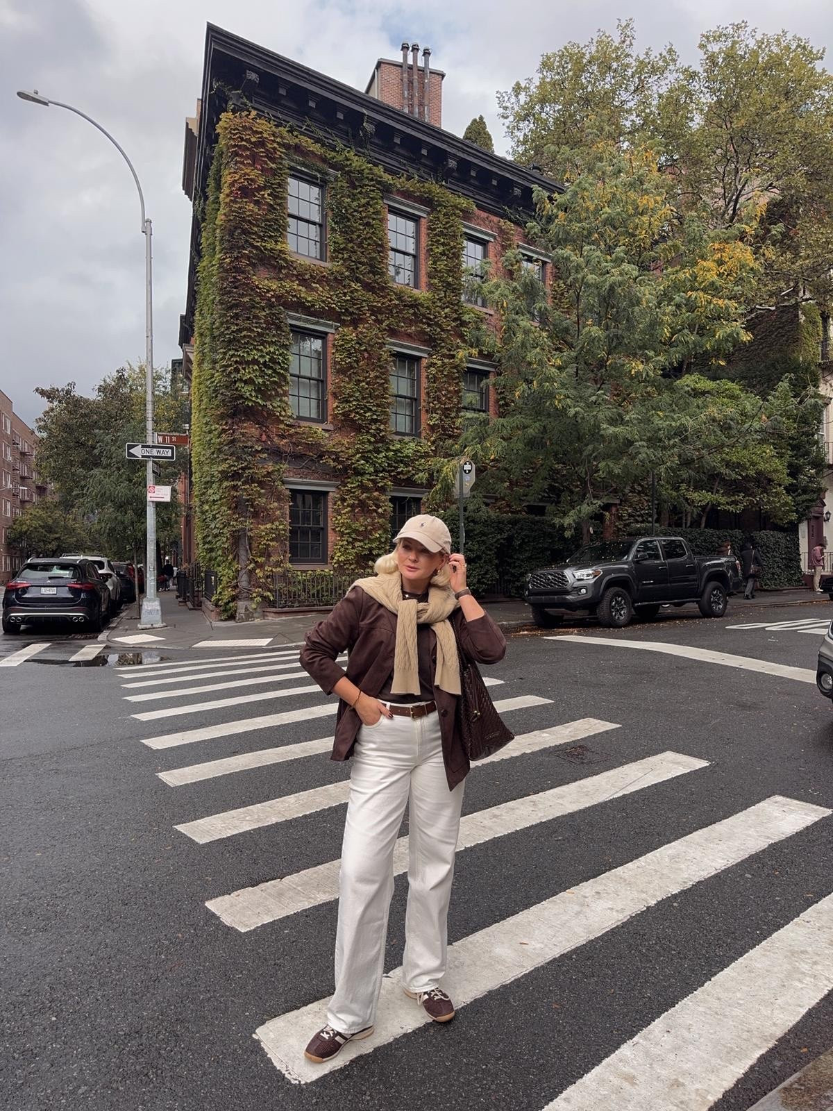Autumn New York City outfit inspiration - Aligne white straight leg jeans, adidas brown trainers, wat the brand chocolate brown top, H&M brown faux suede napped jacket blazer, Abercrombie beige cable knit jumper over the shoulders, Katie loxton brown woven shoulder bag & Ralph Lauren beige cap  

#LTKuk #LTKautumn #LTKstyletip