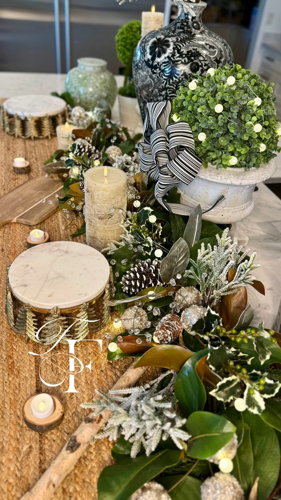 A little winter + rustic holiday moment 🤍🌿
My kitchen island is dressed up in black & white Christmas party for tonight’s holiday celebration.🎄
Nothing I love more than making a space feel festive with a thoughtful theme ✨

Faux magnolia leaves, holly, and greenery, mixed with gold and birch branches. Wood cutting boards and gold accents. 

 #LTKHoliday #LTKSeasonal #LTKHome