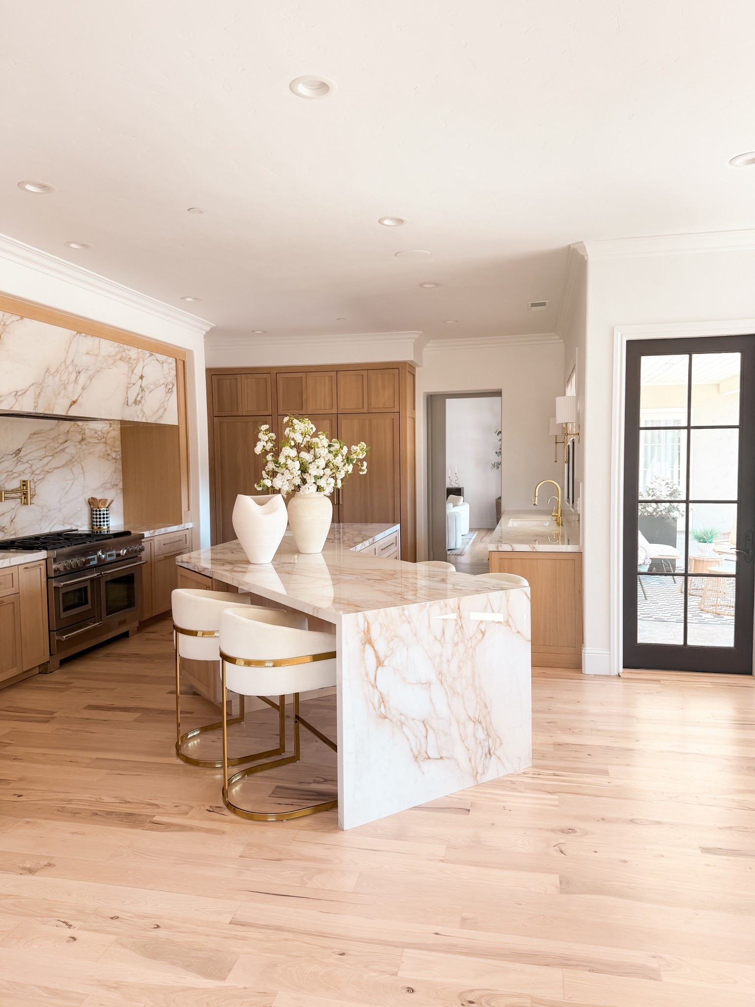 Loving my white oak cabinets with the warm stone brushed with gold hardware 

#LTKHome
