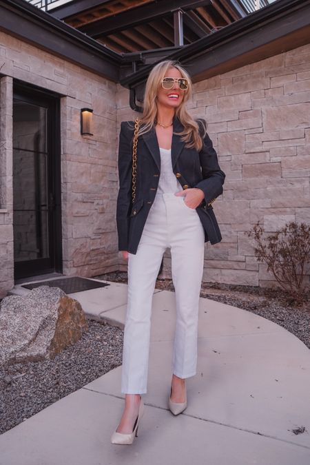 The power piece you didn’t know you needed, and now you won't stop thinking about it… is this gorgeous Veronica Beard denim blazer! And it’s currently 40% off!!!! 

The blazer is SO good because of its sophisticated details like the luxe gold buttons and structured, padded shoulders. The shoulders create width across the top, which in contrast with the tailored waist, gives the illusion of a smaller waist. The cotton blend fabric is thick enough to provide structure but is also quite breathable and lightweight for those who run hot. Since this blazer is denim, you can style it multiple ways: casually for lunch or dress it up for work or dinner.

In this look, I styled the blazer with one of my favorite basic white tees by ATM, a pair of cropped white jeans by L’Agence, and some neutral Sam Edelman pumps. Pairing the blazer with whites and light neutrals like this feels so fresh and springy. 

I completed the look with some cool Le Specs aviator sunglasses and my beautiful Bottega Veneta cassette bag that I’ve owned for a few years. All of these pieces run true to size.

~Erin xo 

#LTKsalealert #LTKSeasonal #LTKstyletip