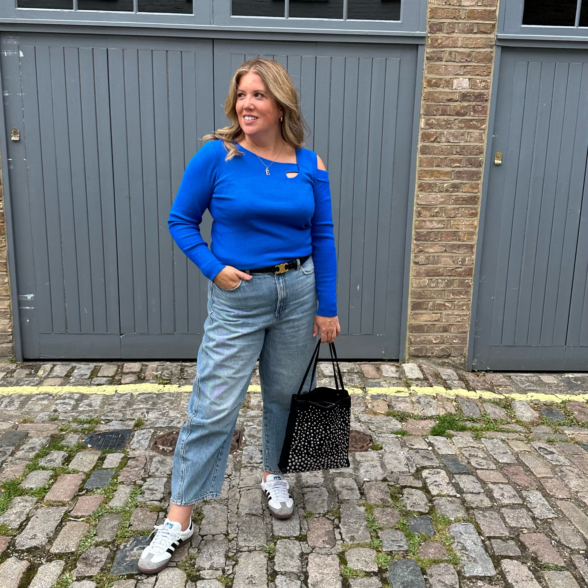Royal blue cut out jumper, jeans and adidas sambas 

#LTKeurope #LTKSeasonal #LTKover40