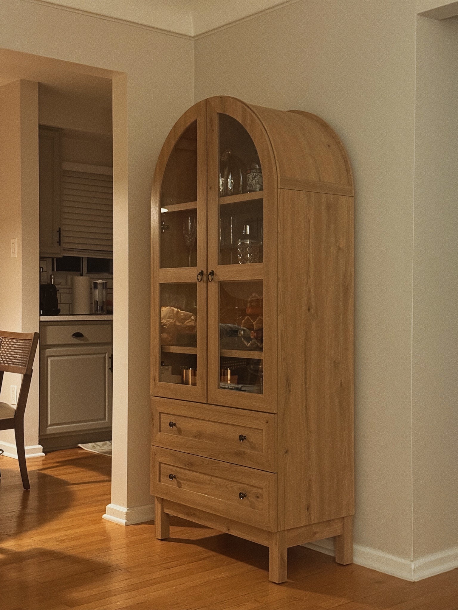 This arched cabinet was a must have to store all our bar cart necessities! Looks luxury but for a fraction of the cost. 

Plus the drawers are great for extra storage of kitchen things from small charcuterie boards and platters to wine stoppers and cloth napkins!

#LTKHome #LTKSeasonal #LTKParties