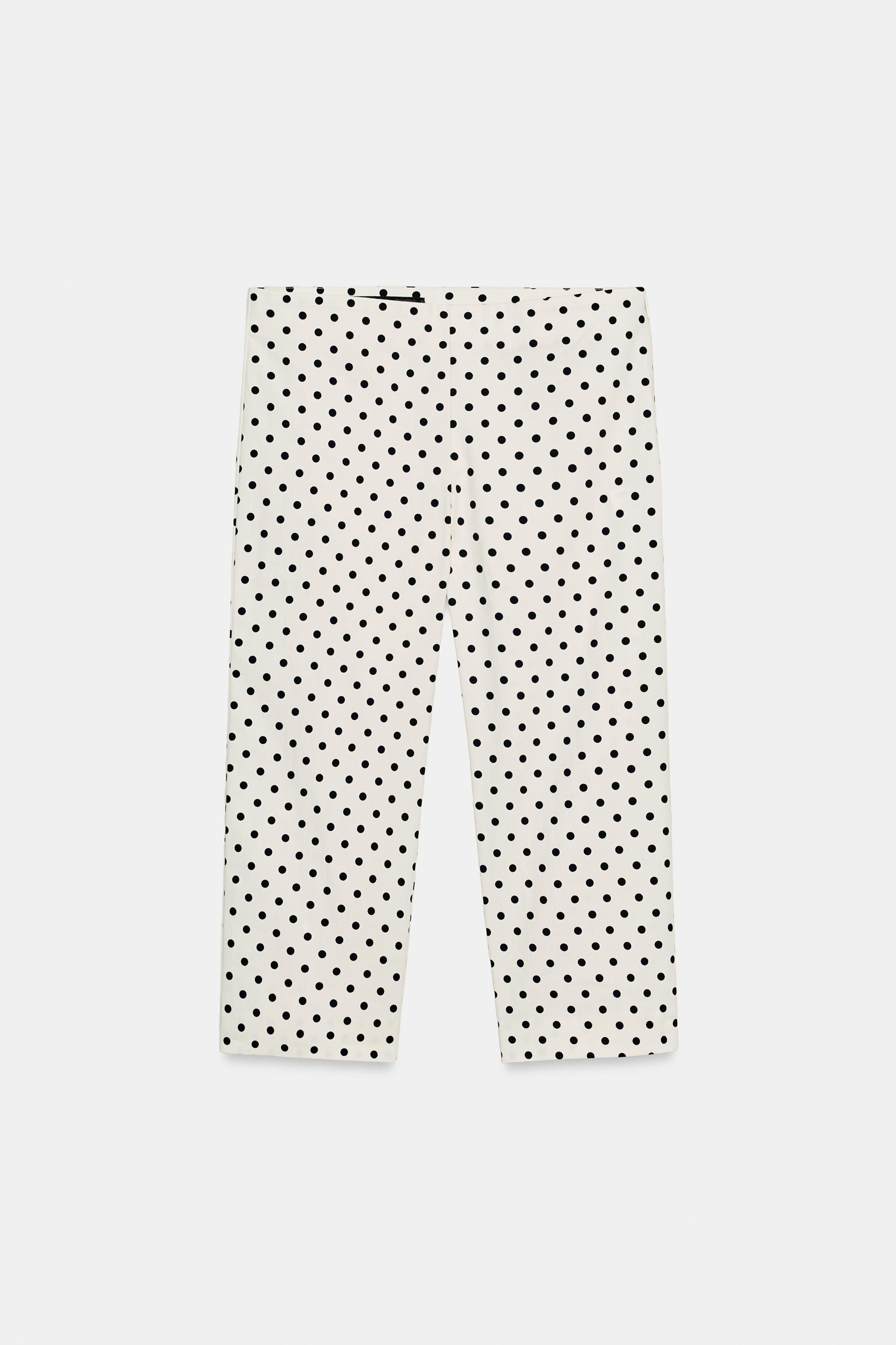 Pantaloni a vita media con elastico in vita. Chiusura laterale con cerniera nascosta nella cucitu... | Zara IT