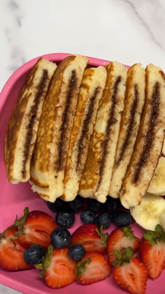 Freeze Nutella discs ahead of time to make mornings quicker and easier. Just grab, cook, and enjoy warm, gooey pancakes in no time! 🥞 💕

	•	Spoon Nutella onto parchment paper in small circles.
	•	Freeze until solid (about 2-3 hours).
	•	Make pancake batter.
	•	Pour batter into a hot, greased pan.
	•	Add a frozen Nutella disc in the center.
	•	Cover with more batter.
	•	Cook until bubbles form, then flip.
	•	Cook until golden brown.
Follow @tinatakeslunch for easy and fun ideas!

#nutella #pancakes 

#LTKFamily #LTKHome #LTKKids