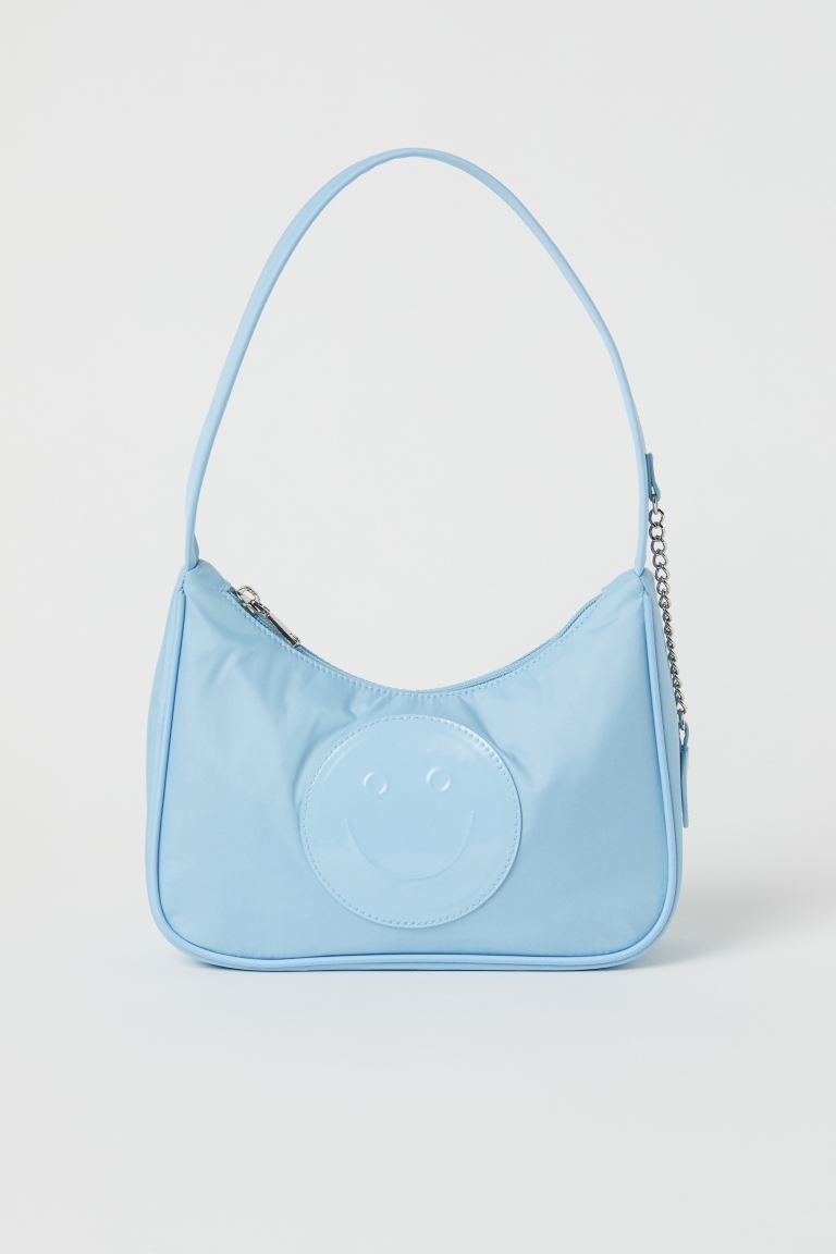 Bag in thick nylon with a handle and zipper at top. Inner compartment with zipper. Lined. Length ... | H&M (US + CA)