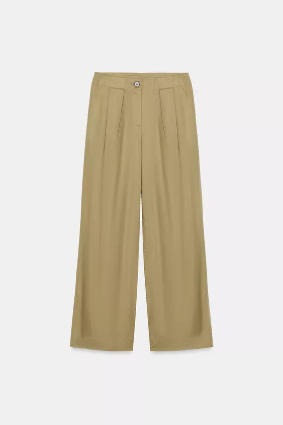 Mid-rise pants with front pleats. Front pockets and false back welt pockets. Front zip and button... | Zara Canada