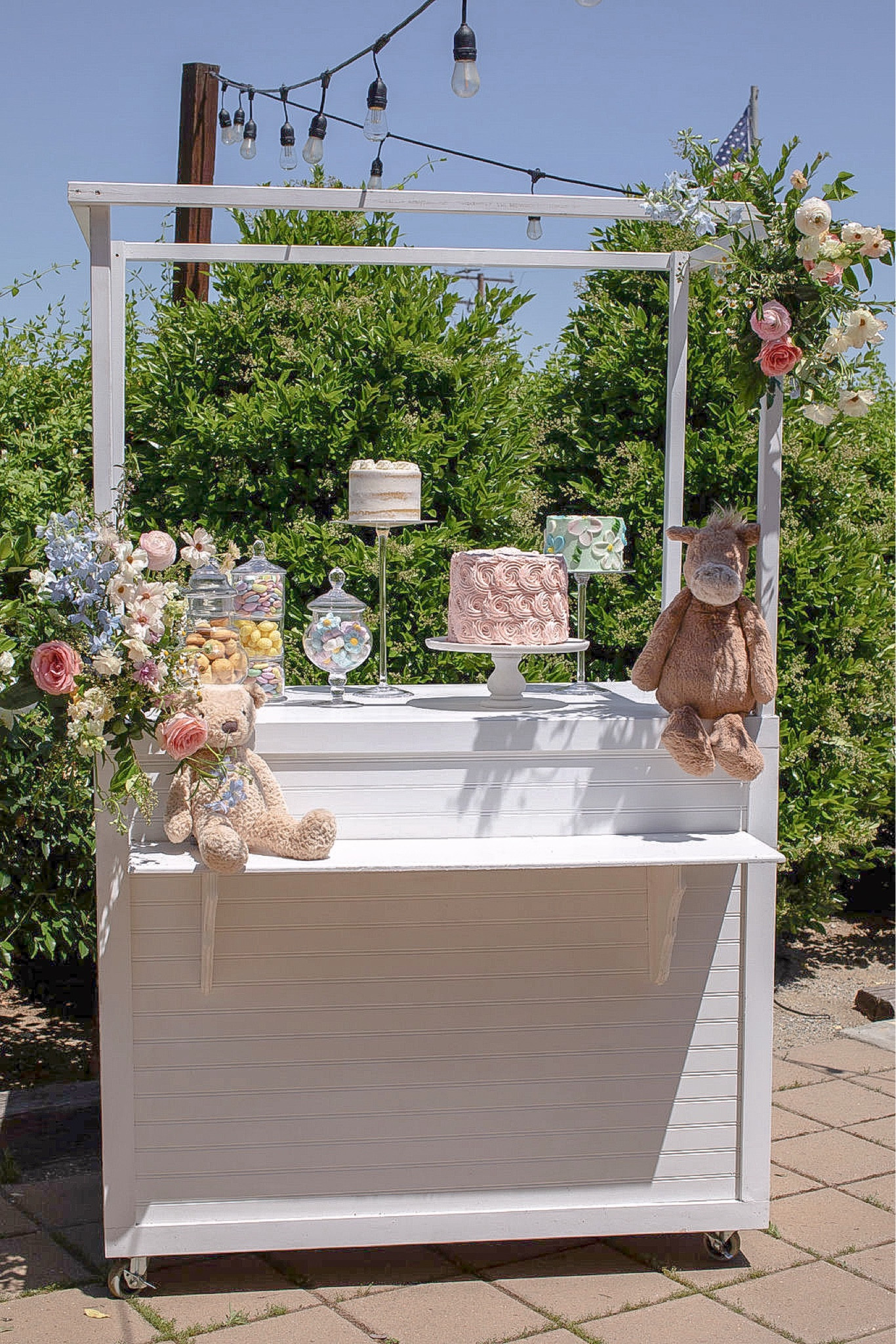 Starting with a few well-placed garden accents, we set the stage for an unforgettable day. The floral arrangements, each carefully put together to match the baby shower's color palette, adorned tables and served as beautiful centerpieces. Fresh flowers are not just decorations but integral to the event's theme, adding pops of color and scent throughout the space. They also lined the seating area where we opened gifts and the dessert carts. They were sprinkled everywhere, because what is a garden party without florals! Pastel-colored balloons and delicately crafted stuffed animals hung above. These details really brought the baby shower to life and were what I had envisioned for 10 years while we patiently waited and prayed for our sweet blessing.

#LTKBaby #LTKHome #LTKParties