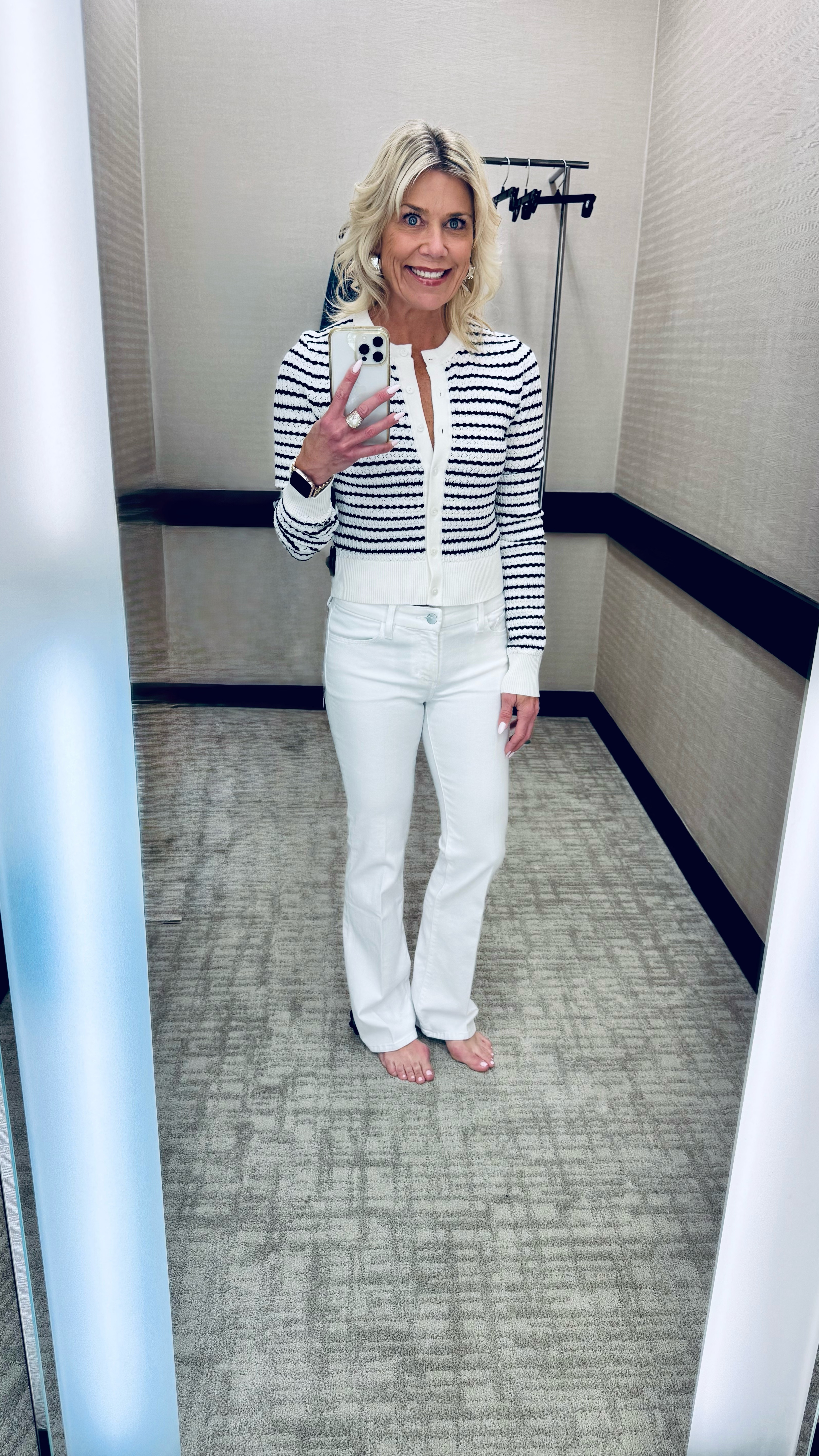 This light knit striped cardigan paired with white jeans is your perfect casual, chic spring outfit to wear. Love being able to unbutton the top and wear jewelry or unbutton the bottom buttons if wearing with high-rise jeans. These are a slim bootcut petite jeans. Both fit true to size. I’m in size 25 jeans and size XS top.

#LTKWatchNow #LTKOver40 #LTKStyleTip