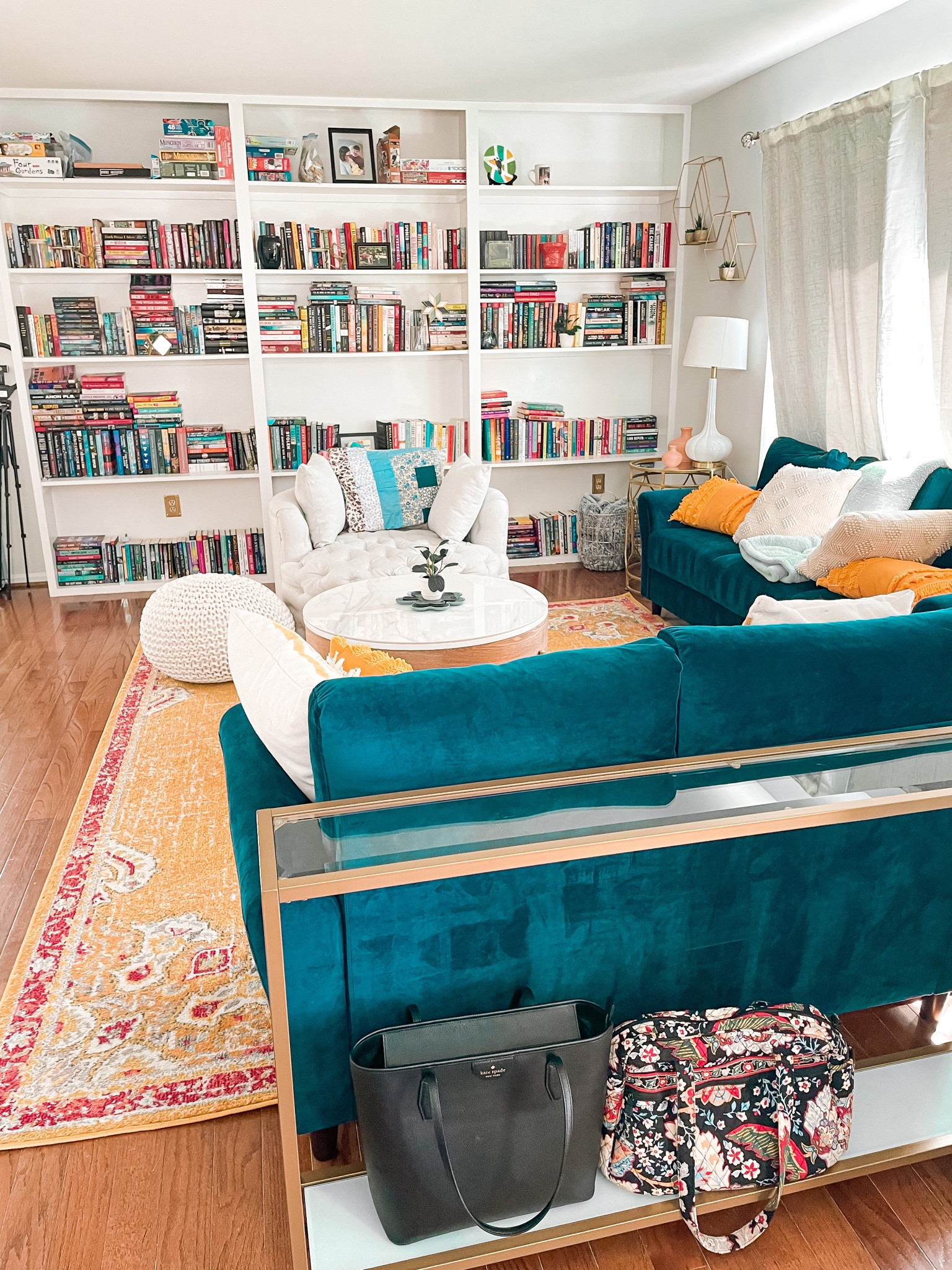 Reading room, living room, sitting room, velvet couch, in-home library, bookshelves, reading chair, living room furniture, coffee table, accent table, purse, Kate Spade purse

#LTKitbag #LTKsalealert #LTKhome