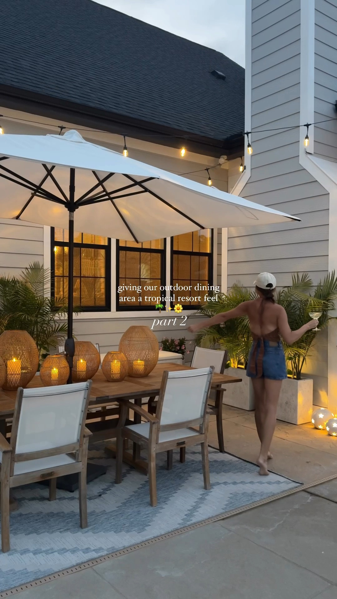giving our outdoor dining area a tropical resort feel pt. 2 ✨| refinishing the table & chairs was a true labor of love, string lights work on an app and the woven candle hurricanes steal the show 😍

save for backyard inspo 🫶🏼

#backyard #outdoordining #alfresco #outdoorfurniture #outdoorliving #backyarddesign #outdoorplants #spring

#LTKHome #LTKFindsUnder100 #LTKSeasonal