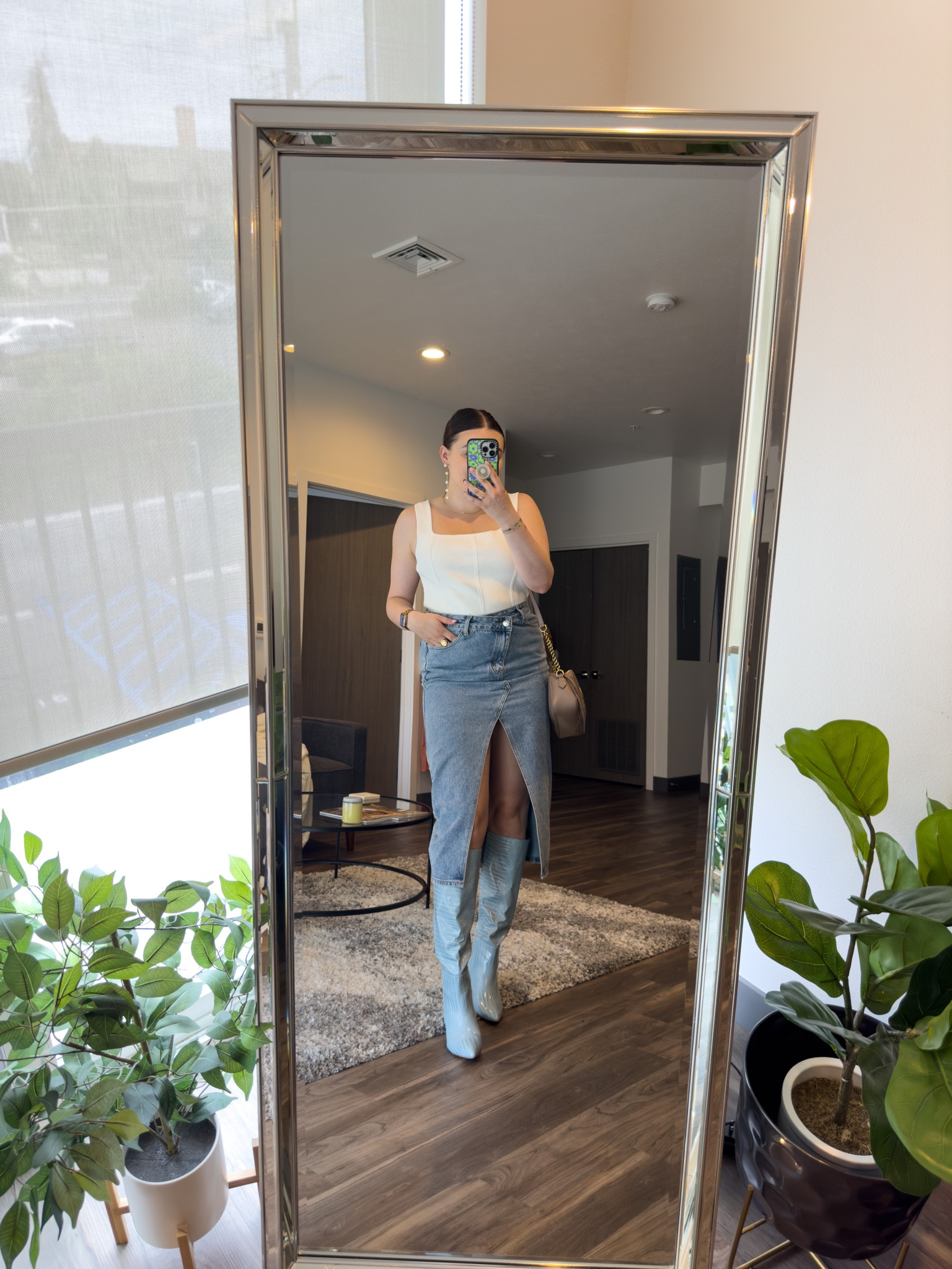 Blue and white outfit for brunch! Featuring the best statement boots and a denim midi skirt. 

I’m wearing a L skirt and size 9 boots. Tank is NanaMacs, use code LAURENTRIVISON15 for 15% off!

#LTKshoecrush #LTKunder100 #LTKSeasonal