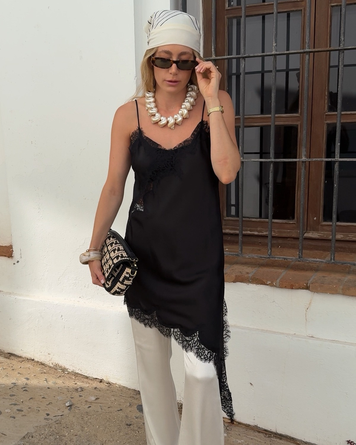 end of summer outfit • wearing a white silk pants combines with a black lace top, an headscarf and summery accessories #lacetop #headscarf #scarfstyling

#LTKstyletip #LTKdeutschland #LTKeurope