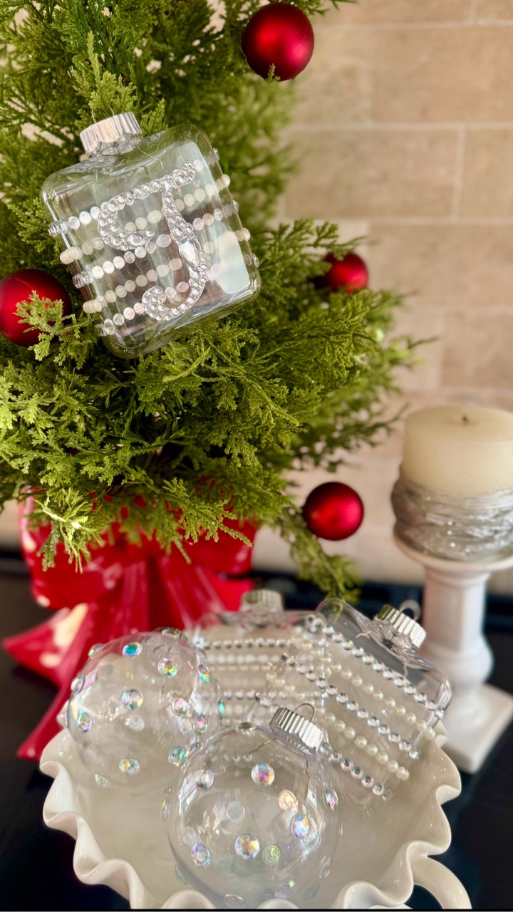 Bring a touch of sparkle to your holiday decorating with these DIY crystal Christmas ornaments! I started with clear glass ornaments and dressed them up using stick-on pearls, iridescent gems, and rhinestone strips for the prettiest soft-glam look. They catch the light beautifully on the tree and look just as stunning displayed in a bowl or tray. This is an easy, affordable craft that instantly elevates your Christmas décor—perfect for gifting, personalizing with initials, or adding a custom luxe touch to your tree. ✨🎄💗

#HolidayDecor #ChristmasDIY #DIYOrnaments #GlamChristmas #CrystalOrnaments #PearlOrnaments #HolidayCrafts #ChristmasAesthetic #LTKHoliday #LTKHome #LTKSeasonal #LTKGiftGuide #HomeForTheHolidays #BlingDecor #HolidayInspo #ChristmasTreeDecor #ClearOrnaments #DIYHolidayDecor #LTKDIY #JustJennsDesign

#LTKSeasonal #LTKHoliday #LTKHome