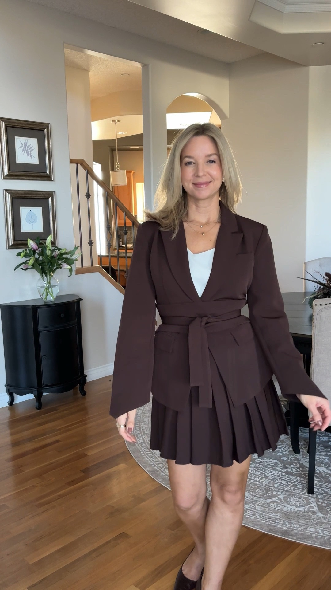 The pleated mini skirt and jacket comes in a few colors and is incredibly flattering to the waistline.
I’d call this an espresso brown color 

It has this additional piece that wraps around the waist (kind of like a cumberbund) and cinches you in! 

Wearing size M in both pieces

#LTKOver40 #LTKWorkwear #LTKStyleTip
