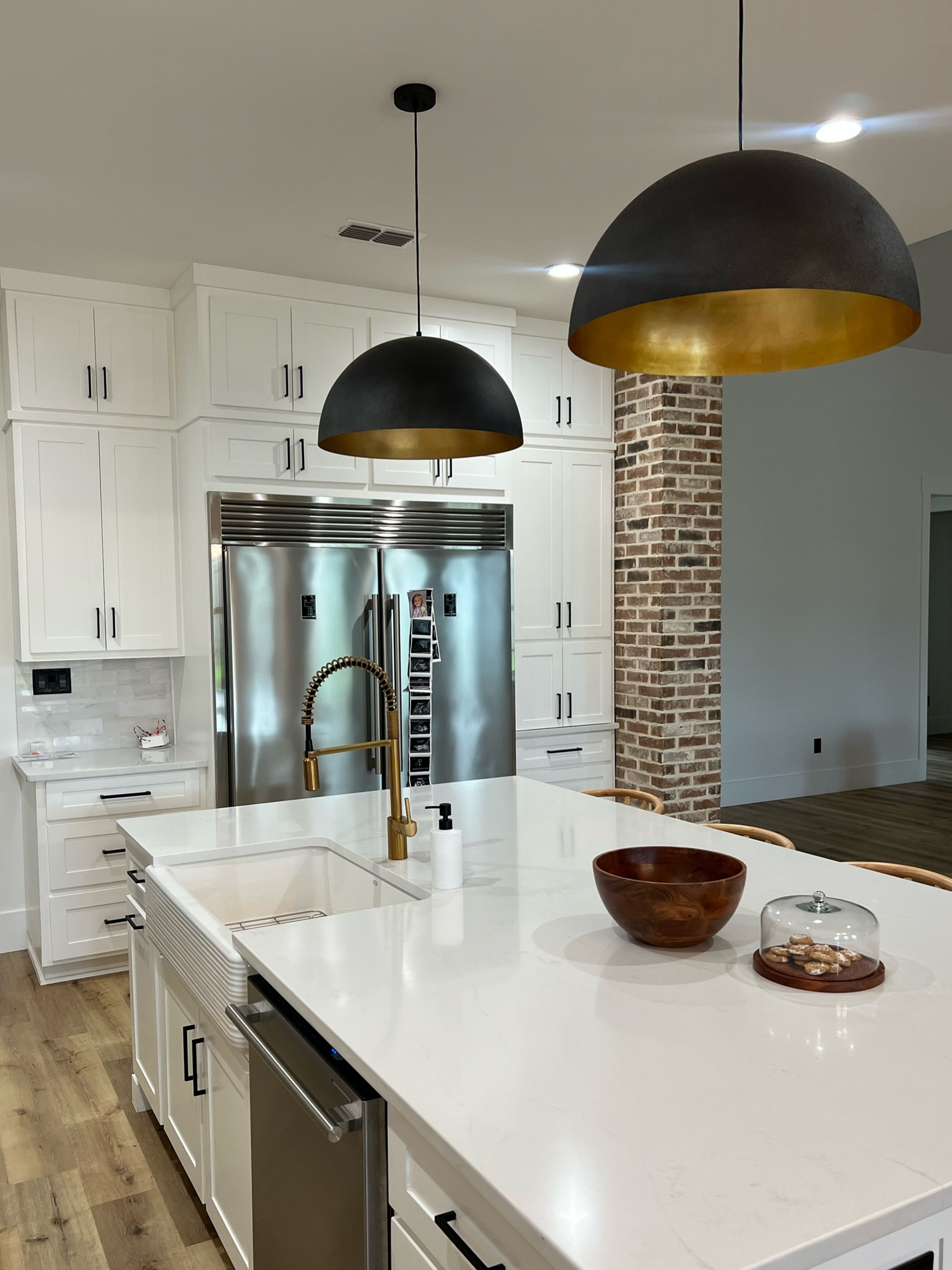 Kitchen island pendants! I had my eye on these our whole build & just knew I had to have them!! #reginaandrews #sigmundpendant

#LTKhome #LTKFind #LTKstyletip