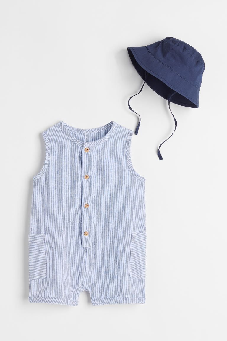 Sleeveless romper suit and a bucket hat in soft, woven cotton fabric. Romper suit with buttons at... | H&M (US + CA)