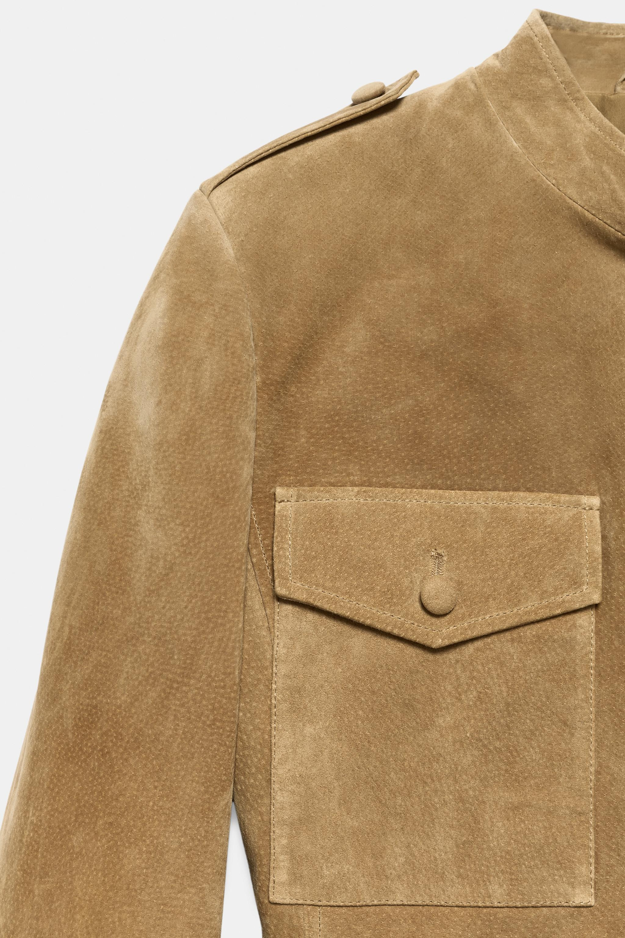 Jacket made of 100% leather. Featuring a high neck, long sleeves with shoulder tabs and shoulder ... | Zara UK