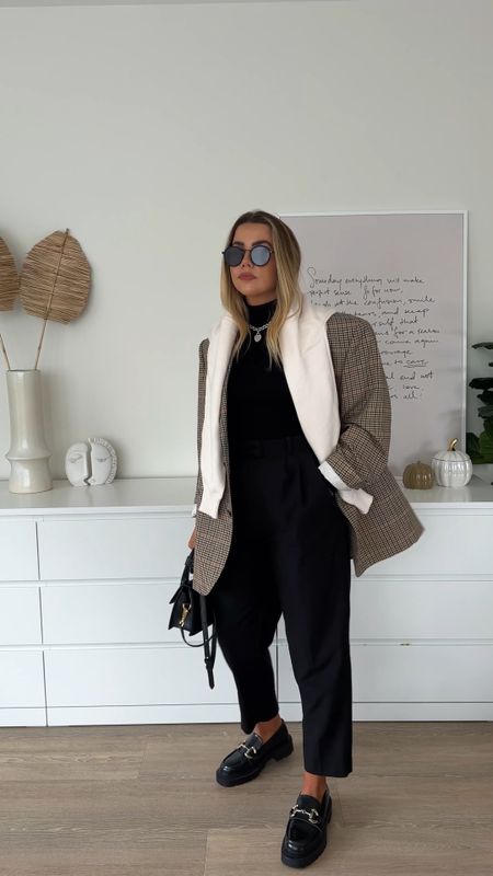 Effortless everyday outfit for the perfect autumn style inspiration. Styling a brown check oversized blazer with black roll neck and tailored trousers, teamed with loafers and a cream knit over the shoulder. 

#LTKeurope #LTKstyletip #LTKunder50