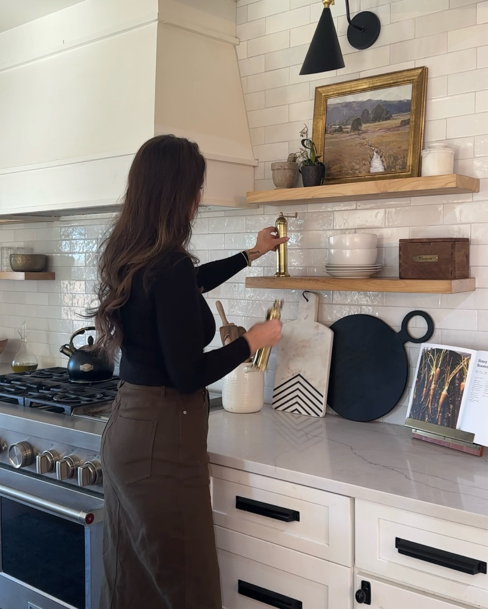 Styling open shelving in my kitchen with my pieces from P&V. Love these brass salt and pepper mills with my cutting boards. Added some artwork and some salt cellars and pinch pots. 

🏷️ kitchen decor // midi skirt // open shelves // wood shelves // kitchen design // kitchen inspo // salt mill // pepper mill // charcuterie boards // cookbook

#LTKSeasonal #LTKHome