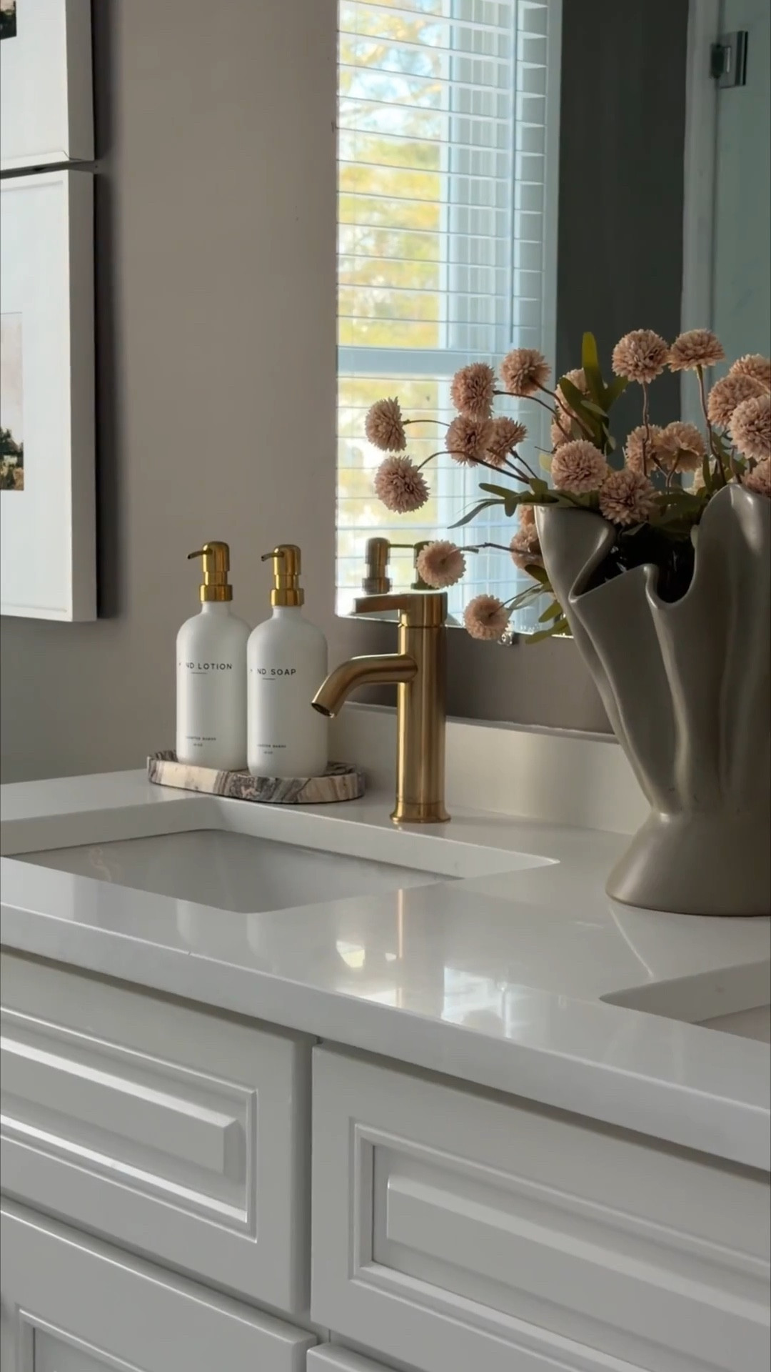 Builder grade to warm and cozy! Our guest bathroom was the only untouched room left in our home, and we finally made some budget friendly updates. We swapped all the hardware and plumbing for these beautiful gold finishes and I love how much warmer it feels! 

#LTKHome