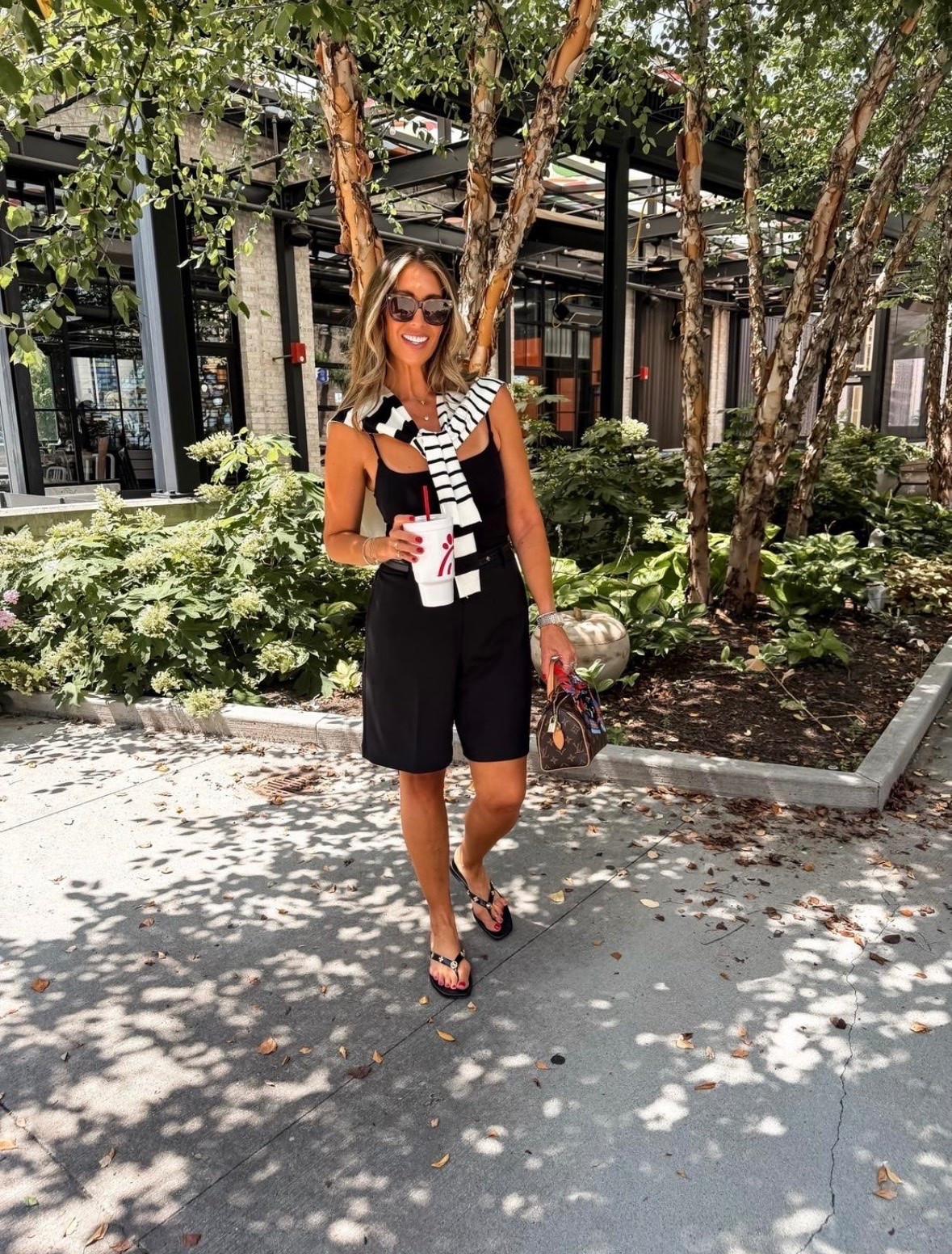 I wore this for a quick lunch run and loved how the longer tailored shorts made the outfit feel more polished than typical summer basics. The fitted black tank keeps the silhouette clean, while the striped sweater adds contrast and gives me an easy layer for cold air conditioning.

Bermuda shorts outfit, black summer outfit, tailored shorts, striped sweater, casual lunch outfit, polished summer style, over 40 fashion, warm weather outfit, everyday style, themominstyle

#LTKootd #LTKSeasonal #LTKOver40