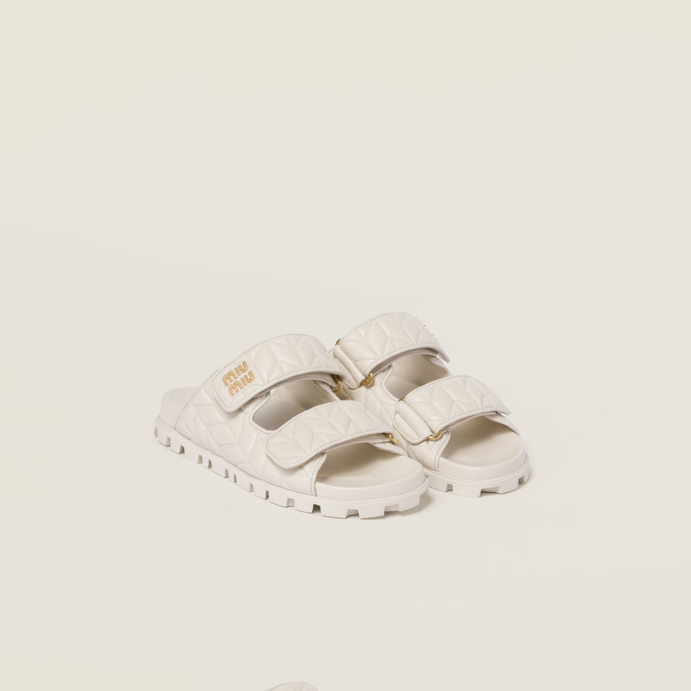 White Matelassé Nappa Leather Slides | Miu Miu | Miu Miu US