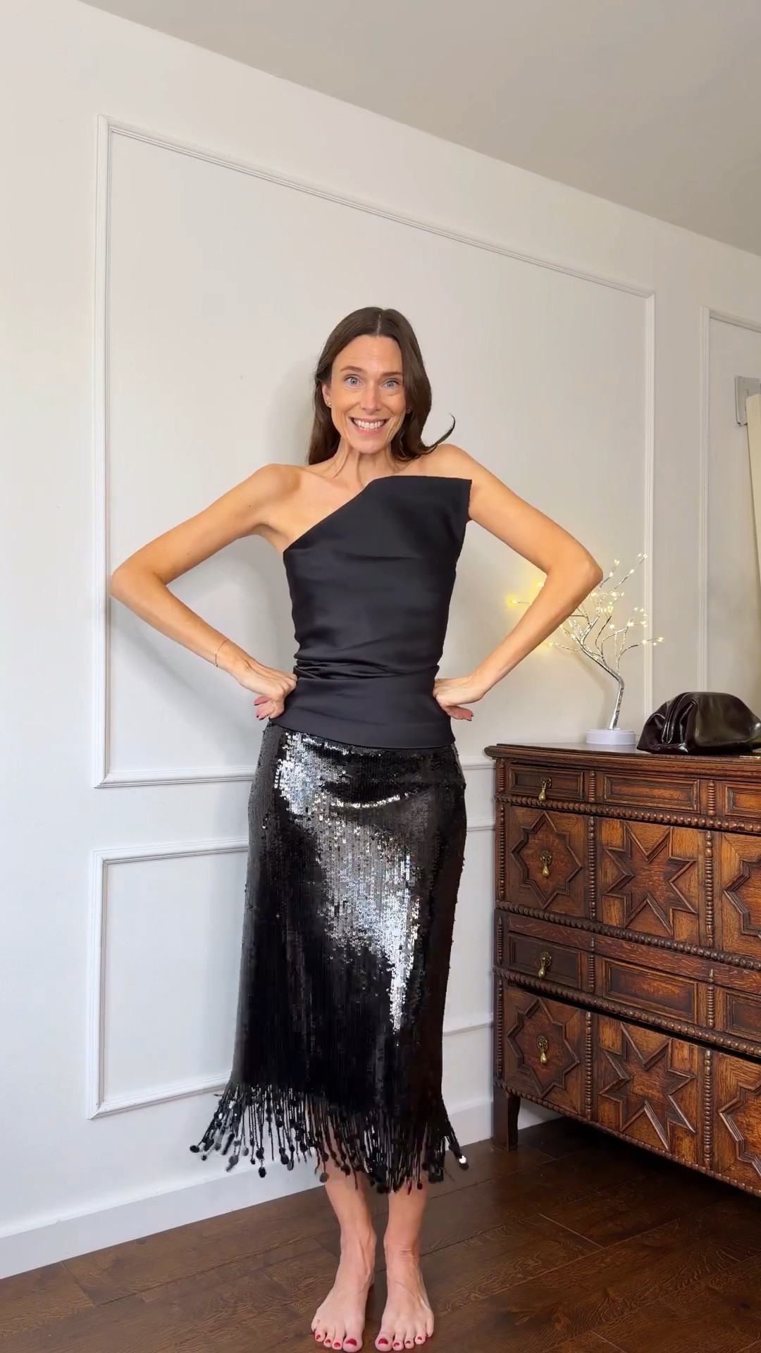 An all black Christmas party outfit. I love a sequin skirt for this time of year, but a bandeau top will always have my heart 🫶🏻 It’s just the best shape for me!

What to wear over 40, Christmas party outfit, holiday party outfit, satin top  

#LTKootd #LTKOver40 #LTKHoliday