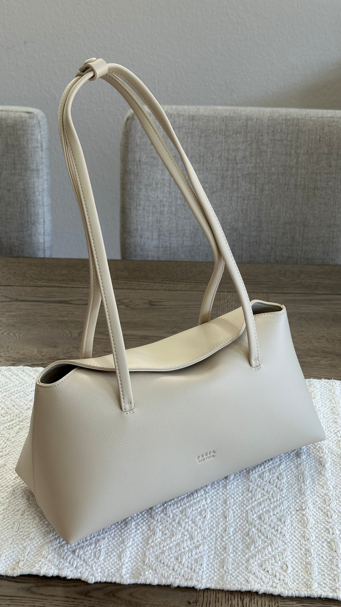 The everyday neutral bag you didn’t know you needed! This structured beige shoulder bag is the perfect blend of minimal, chic, and functional—fits all the mom essentials too. Style it with casual or dressy looks for an elevated touch. #neutralbag #shoulderbag #everydaystyle #LTKaccessories #minimalstyle #momstyle

#LTKWorkwear #LTKItBag