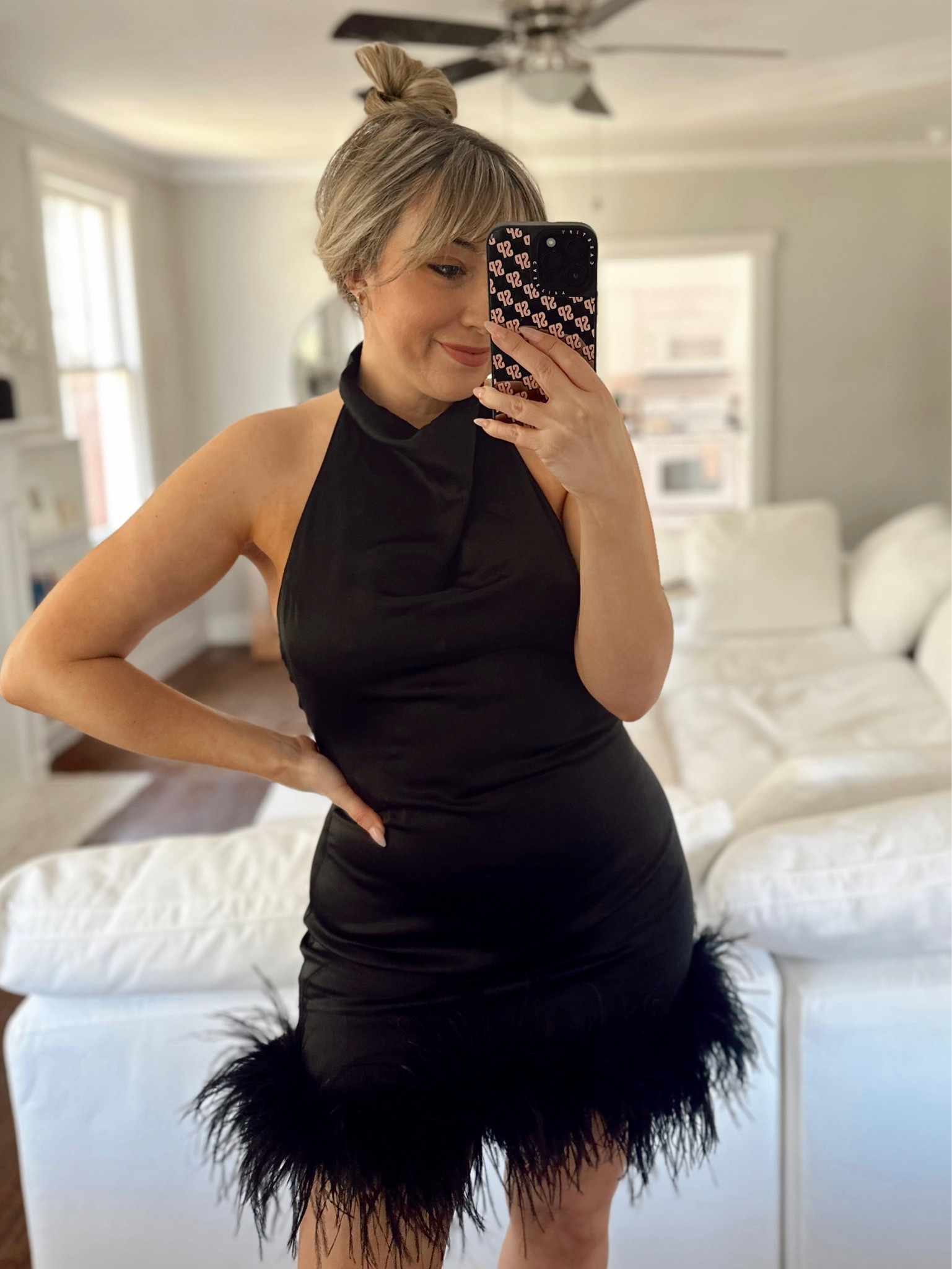 This gorgeous satin halter dress is the perfect glam cocktail dress! I love the feather trim and low back! 

#LTKFind #LTKstyletip