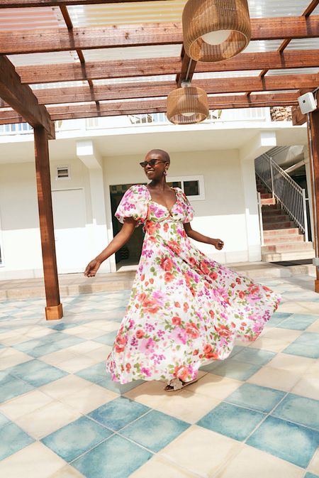 The ultimate spring dress! Floral puff sleeve dress with tie back, cherry earrings and white floral sandals. Great wedding guest dress too  

#LTKwedding #LTKstyletip #LTKshoecrush