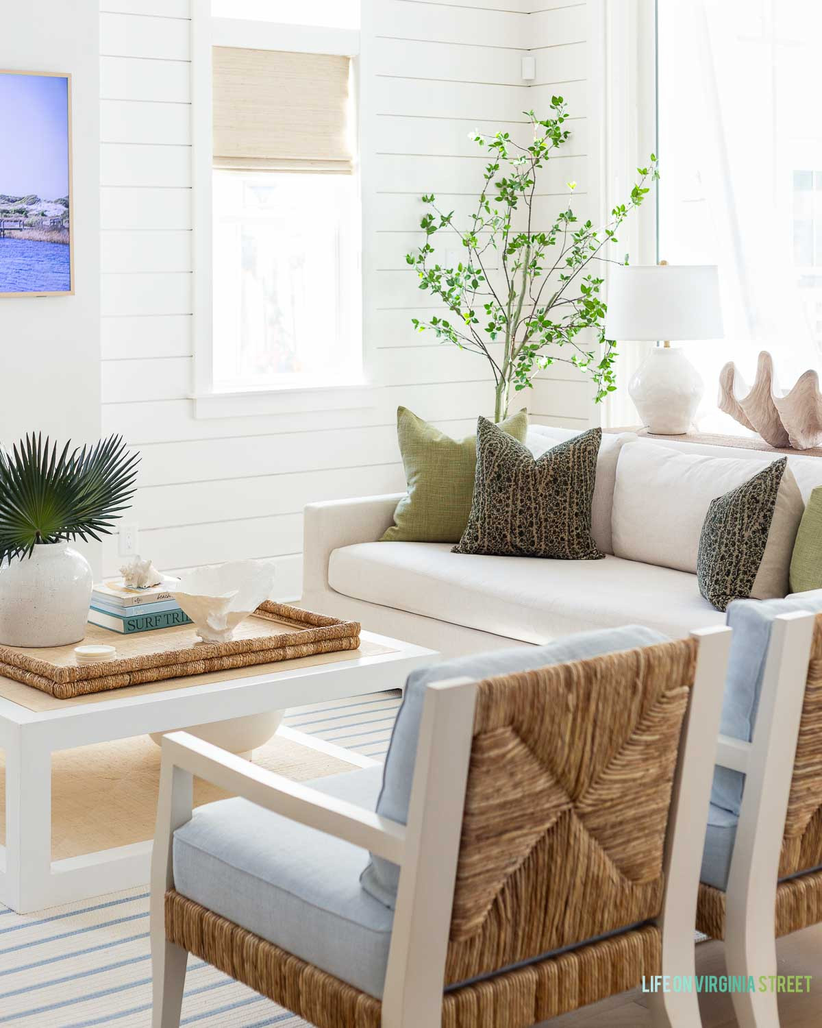 Coastal living room decor // modern coastal Florida home // throw pillow // coffee table // faux tree 

 #LTKSeasonal #LTKHome