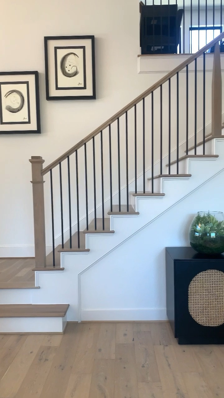 BEFORE AND AFTER➡️
Wanted a neutral, modern and inviting.
Black iron balusters pop out with these creams and whites. I love this console table, or tv unit used.

#LTKhome #LTKstyletip #LTKFind