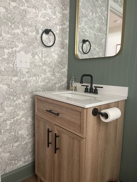 Vintage style half bathroom makeover. Black accents with gold mirror and wood vanity. #bathroommakeover
#vintagewallpaper

#LTKunder50 #LTKFind #LTKhome
