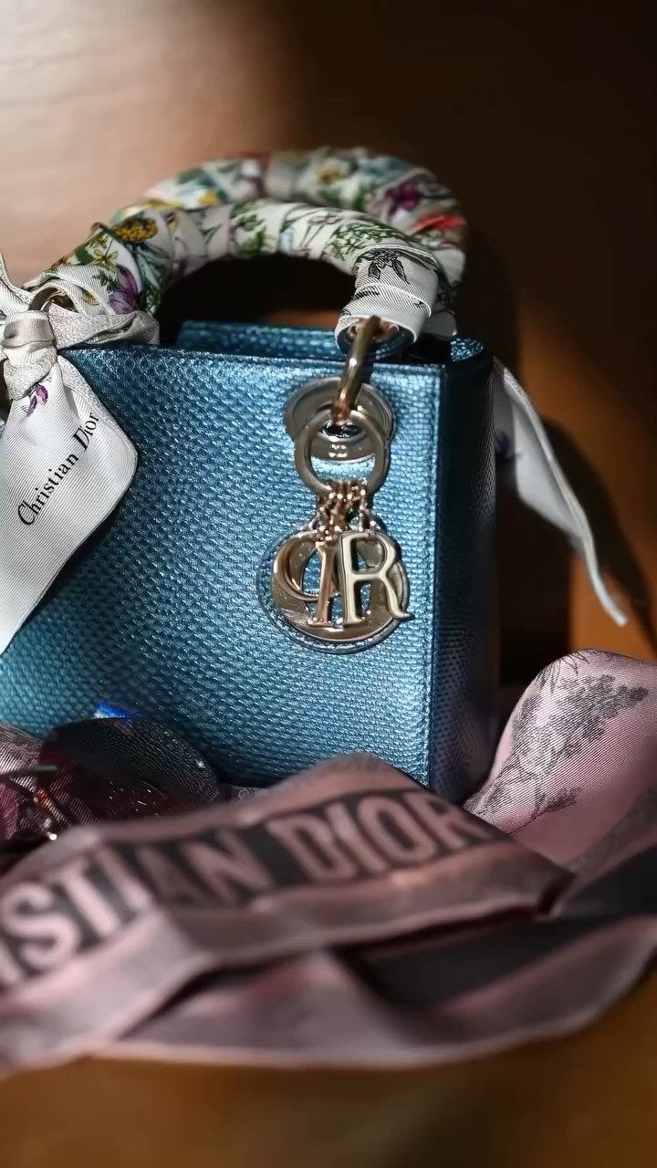 Over the last couple of years, I have become a fan of the Lady Dior handbag. In particular the exotic versions of the mini LD. This one is dubbed the “mermaid” made from lizard and purchased at the flagship store in Paris.

I saw it and was obsessed. I bought it within 5 minutes. I made sure the handles were wrapped with mitzahs or Dior’s version of the Hermes Twillies. This bag is post momma bag where o no longer carried a diaper or a toy. It’s light weight, classic, and requires my baggage to be minimal which is fine with me.

Ladies…treat yourself often with the finer things in life. Check those lists off not once but as often as you can. Get the bag, take the trip, and just do life. Don’t ask for what you want, expect it. Don’t ask permission to be you! 

 #LTKGiftGuide #LTKHoliday #LTKWatchNow