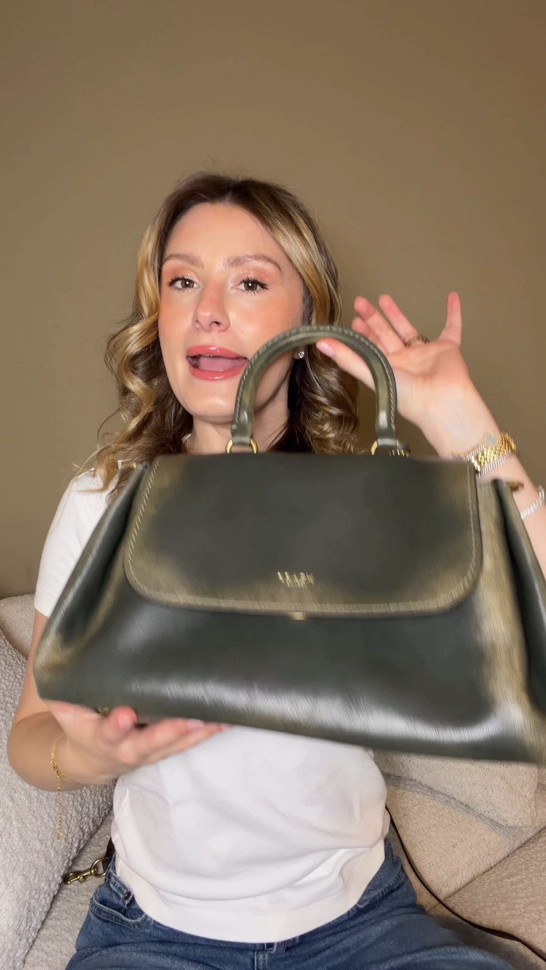 I accidentally found my dream bag that I didn’t know existed 💚 she’s currently out of stock but I will link her so you can check for restocks as well as other colors 💚 Comment SHOP & I’ll dm you the links 💚

I had idea that Coach was releasing an olive loved leather rogue let alone a slouchy loved leather rogue 😱 apparently they leaked in Dillards before the Coach retail drop and people were able to buy them early.

I didn’t know they existed until drop day when I saw an olive green loved leather rogue 31 and the slouchy rogue in store. I knew immediately one had to come home with me 😍

Since I just bought the rogue 31 I. Maple I decided to go with the slouchy rogue and I’m obsessed!

She comes with a crossbody strap, but now I need to find a good shoulder strap for her!