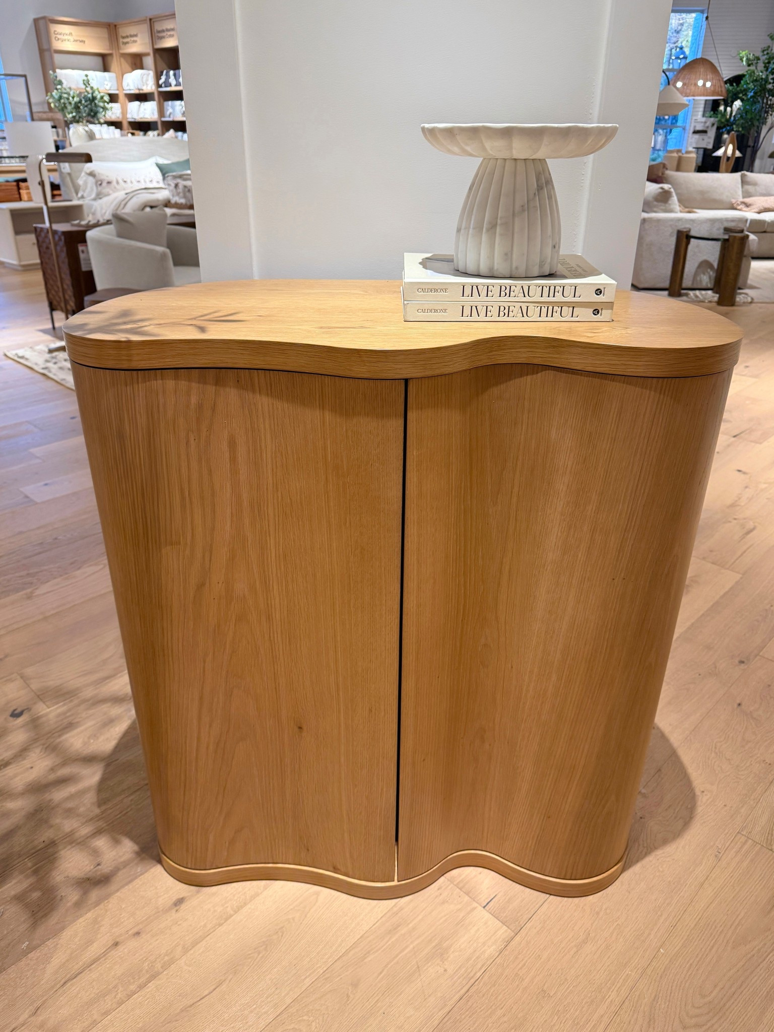 Chic and sculptural! 💫 The Winslow Natural Oak Wood Bar Cabinet from Crate & Barrel stands out with its beautiful oak grain and softly curved, asymmetrical silhouette. 🫶🏻 A modern statement piece that adds warmth and contemporary style to any space. Linked this cabinet and similar styles to shop! ✨ #CrateAndBarrel #BarCabinet #ModernHome

#LTKHome #LTKSaleAlert