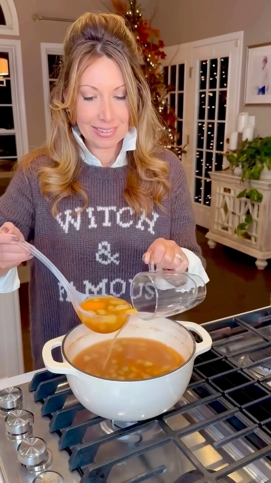 Sip + Simmer Fall Cider 🍂
Linking similar sweater options- my Witch + Famous sweater is sold out. 

Part hot apple cider, part fall simmer pot, and pure autumn magic. Apples, orange peel and cinnamon simmer away on the stove, making the whole house smell incredible — and the best part is, you get to drink it! Add a splash of bourbon for the grown-up version, or leave it out for a delicious hot spiced cider everyone can enjoy.

Recipe:
• ½ gal. apple cider
• 1 Granny Smith apple, diced
• Peel of 1 orange, torn into pieces
• 3 cinnamon sticks
• ¼ c. sugar
• ½ c. bourbon, optional

Add cider, apple, orange peel, cinnamon and sugar to a large pot. Bring to a low boil, then reduce heat and simmer 45–60 minutes. Add bourbon, if using, and simmer another 10–15 minutes.

Ladle into mugs and serve warm. 🕯️🖤

Perfect for a Halloween gathering, a chilly fall night, or anytime you want your home to smell like autumn.

#LTKHome #LTKSeasonal #LTKfoodie