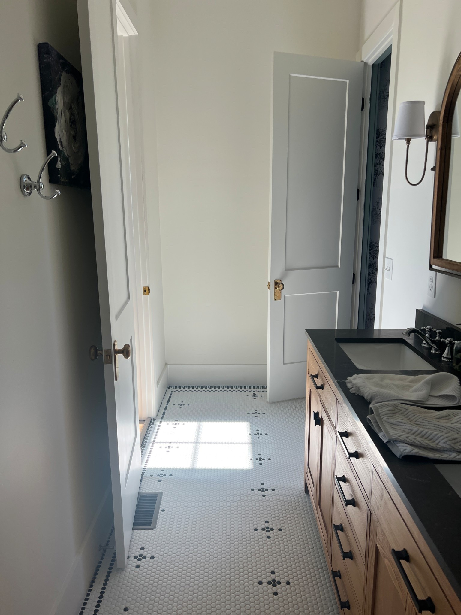 Love this bathroom! From the double vanity to the unlacquered brass door hardware to the penny tile mosaic, it is just a dream 💗

#LTKHome