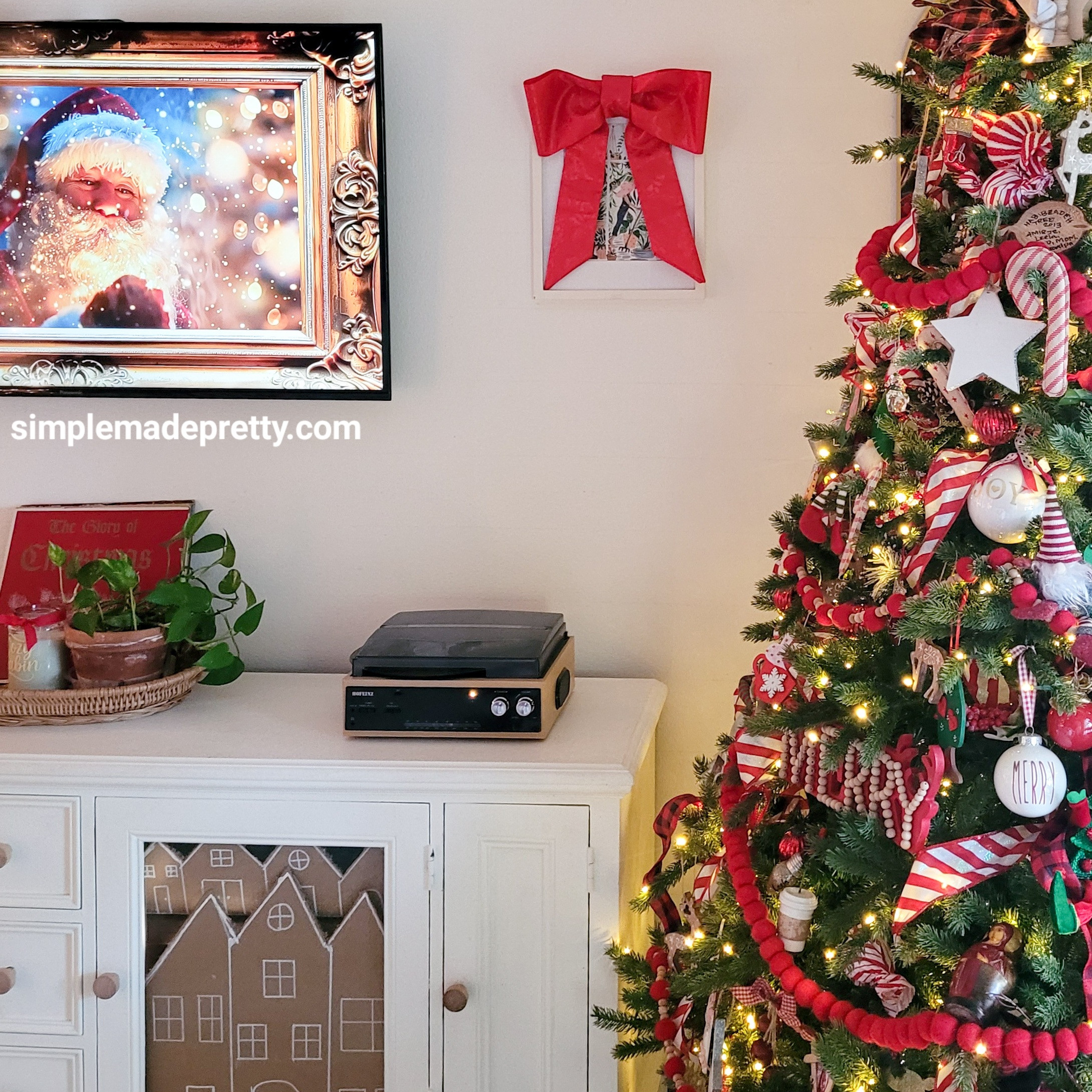 Cozy Christmas lounge activated 🎅✨ Santa on the TV, twinkle lights on, and all the comfy blankets. Linking everything that makes our family room feel extra magical this time of year.

#CozyChristmas #LivingRoomDecor #HolidayHome #ChristmasAesthetic #LTKHoliday #SimpleMadePretty

See the full tour - https://simplemadepretty.com/cozy-christmas-home-tour/ 

 #LTKHoliday #LTKSeasonal #LTKHome