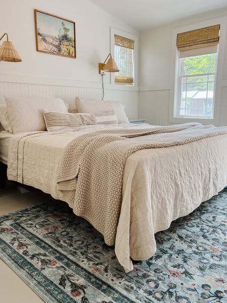 Cozy Beach Cottage Bedroom - New Loloi Rifle Paper rug. Rattan sconces. bamboo Blinds. #LTKFind

#LTKhome