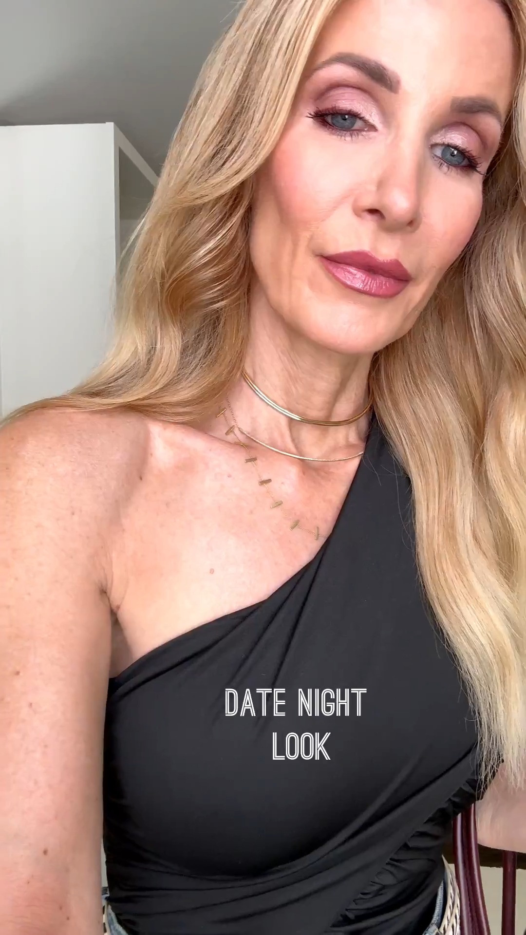 This black one-shoulder bodysuit is fabulous for date night! The flattering ruched detail and open back add a sexy, elevated touch to classic high-waisted jeans. I’m wearing an XS in the bodysuit and a 24 in the jeans. #DateNightOutfit #OneShoulderTop #BodysuitStyle #JeansOver40 #WomenOver40Style 

 