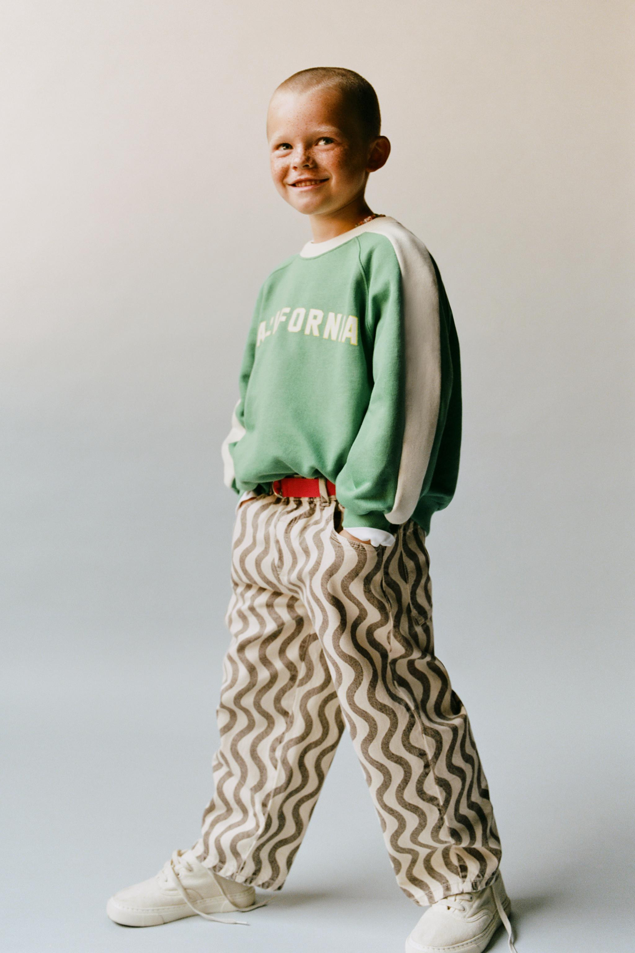 SWEATSHIRT WITH CONTRAST STRIPES AND SLOGAN | Zara UK