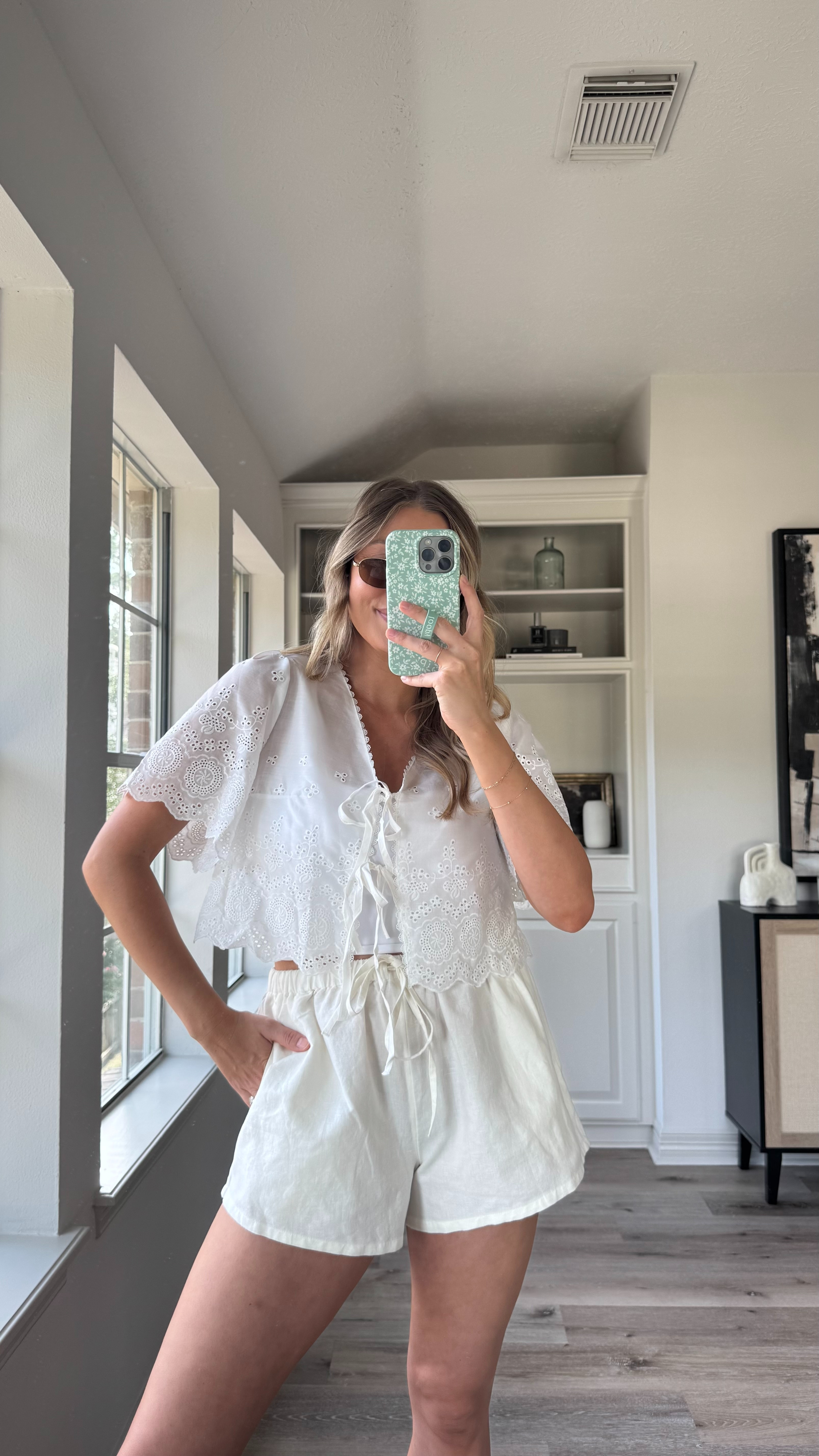 The prettiest nursing friendly top for summer!! The details are absolutely gorgeous! I just layered a sports bra tank under for more coverage. Wearing a size S in the top, M in sports bra tank, and M in white linen shorts. #founditonamazon
 

 

#LTKSeasonal #LTKFindsUnder50 #LTKStyleTip