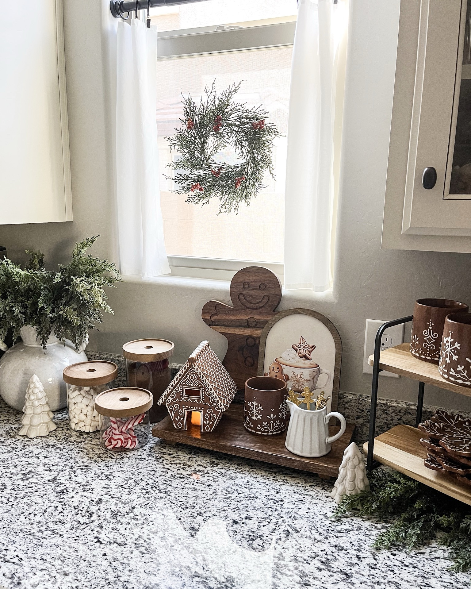 CHRISTMAS cocoa bar!  Follow @lifeinmyarizonahome on Instagram for more holiday ideas and inspiration. 

Right now all the gingerbread collection is on sale!!  If you have 
been eyeing this collection now is the time to stock up for next year.  

I had so much fun setting up my Christmas cocoa and coffee bar with these adorable gingerbread pieces.  This is always such a special place to have set up for the holidays…and I’m sharing everything you need to have the perfect festive setup right at home!

For reference I used 6 of the cedar stems in the vase, and 2 under the tiered tray to balance out the greenery. The arch cocoa frame is in the 10x7 size.  

#cocoabar #gingerbreaddecor #christmasdecor #christmaskitchen #hotchocolate 

#LTKHome #LTKSaleAlert #LTKHoliday