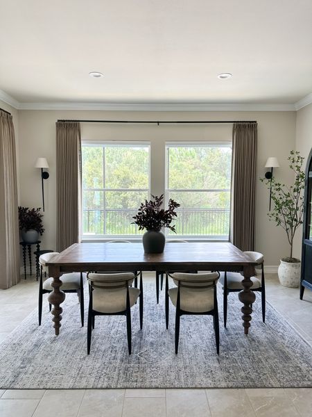 Loving this view ever since we added these beautiful new curtains to the space. Totally elevated the look!

Triple pleat curtains, pinch pleat curtains, Loloi rug, Hattie cabinet, Jagger chairs, Z, Gallerie sconce,