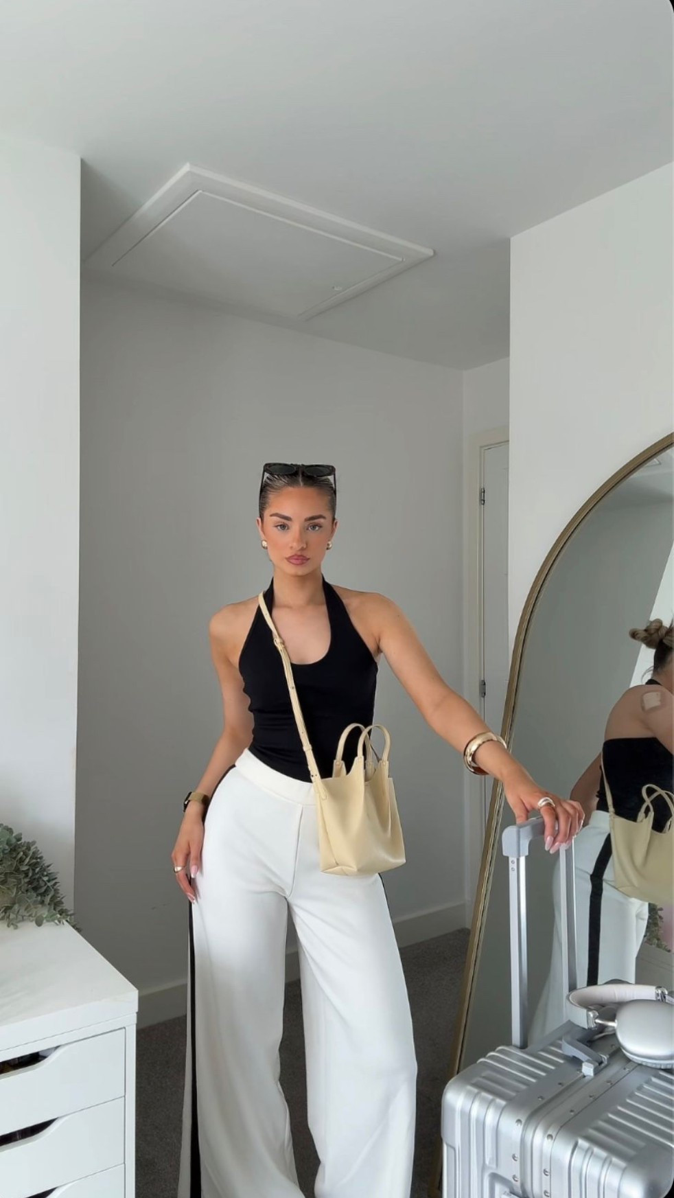 Airport outfit - M&S - white staple trousers - black vest - spring outfit 

#LTKuk #LTKstyletip #LTKspring
