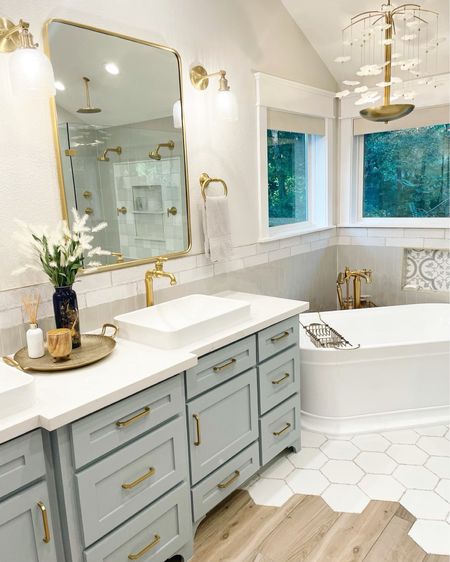 Never underestimate the power of ‘finishing touches!’ This stunning #primarybath we remodeled shines even more with the final decor 🙌🏻
#WoodlandsStyleHouse 

#LTKstyletip #LTKhome #LTKunder50
