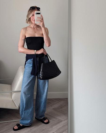 Jeans and a nice top outfit 👖🖤

Black bandeau top (oh Polly Allegra similar linked)
Levis jeans
Dragon diffusion tote
Sezane sandals

