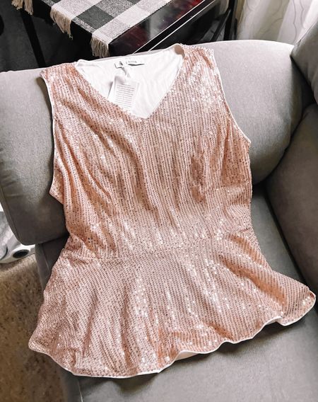 Gorgeous champagne colored sparkly peplum top perfect for both the holidays and the new year! Normally a L/XL and got this in XL. Super cute, sequins are subtle and the shirt is overall really nice quality. Several color choices!

Sparkle shirt
Sequin shirt
Gold sequins
Champagne sequins 
Amazon fashion

#LTKHoliday #LTKSeasonal #LTKunder50